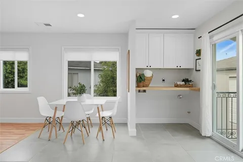a view of kitchen with furniture and wooden floor