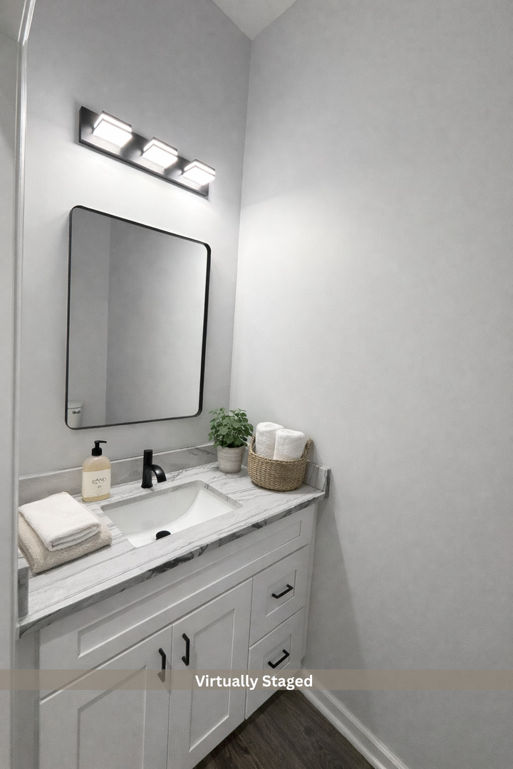 692 Penrose Road Dixon, IL 61021 - Photo 19 of 25 a bathroom with a double vanity sink and a mirror