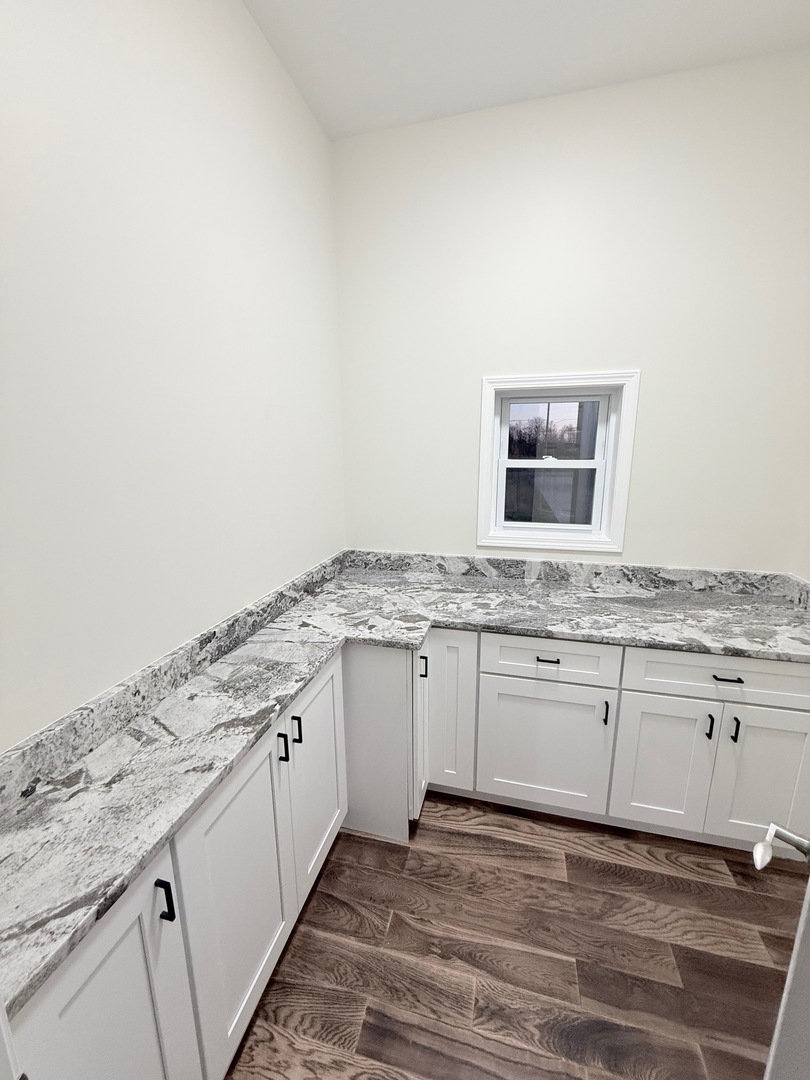 692 Penrose Road Dixon, IL 61021 - Photo 20 of 25 a view of a kitchen with granite countertop cabinets stainless steel appliances and sink