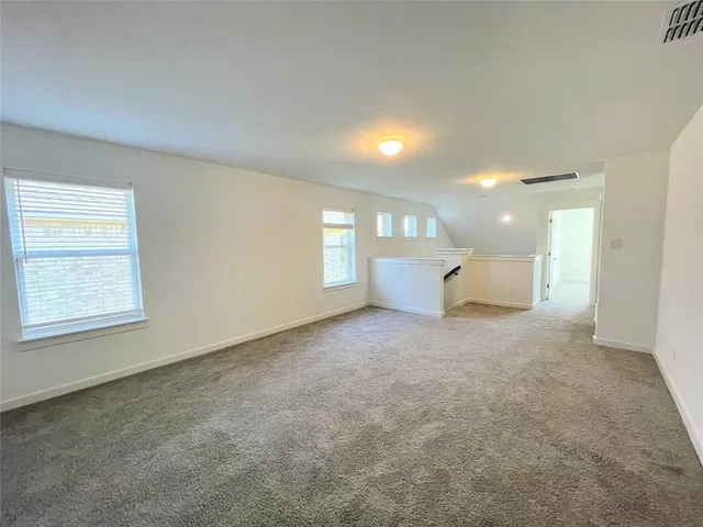a view of empty room with windows