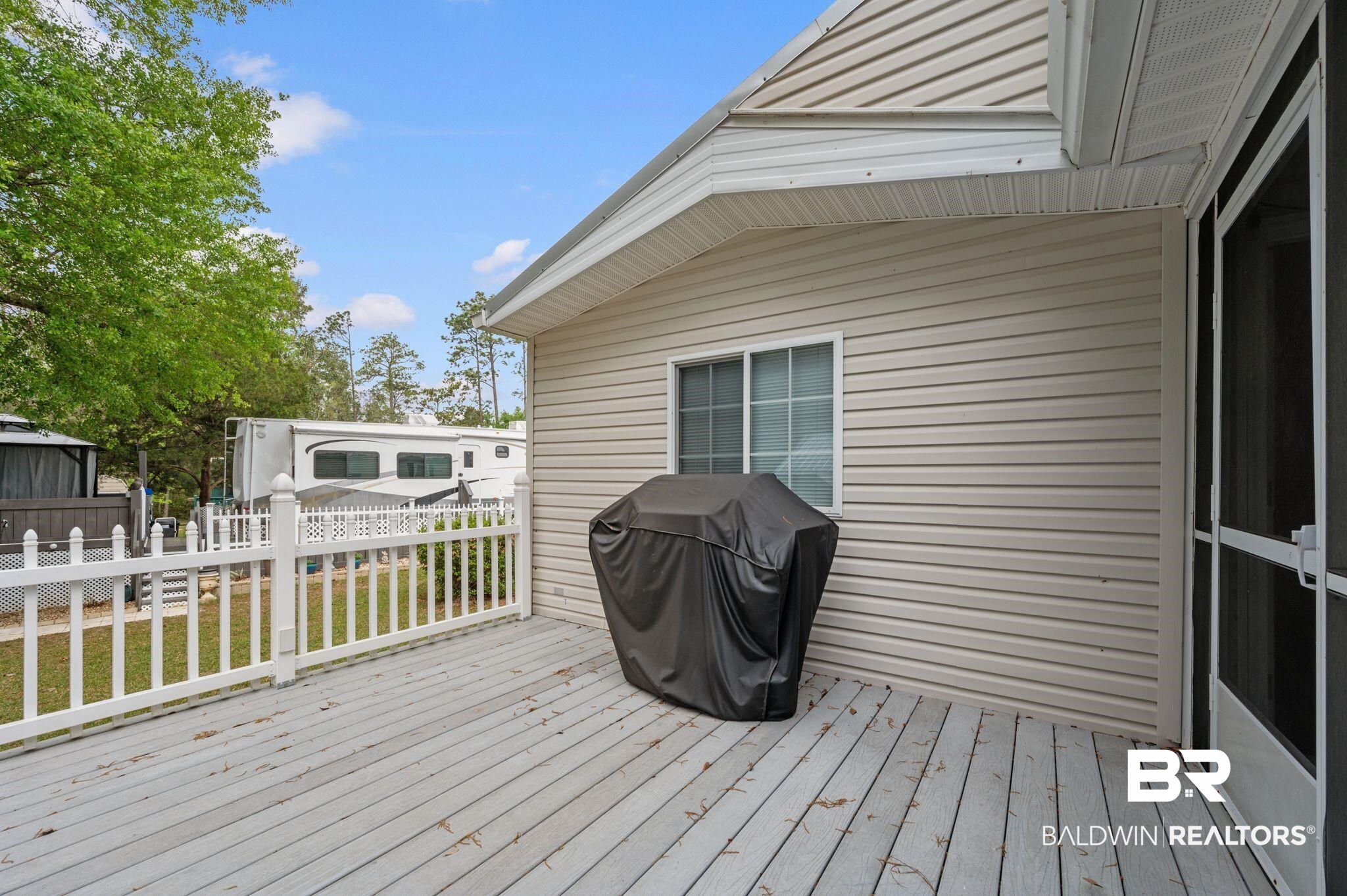 24711 County Road 20, Unit A11 Elberta, AL 36530 - Photo 22 of 35 Wooden terrace with grilling area