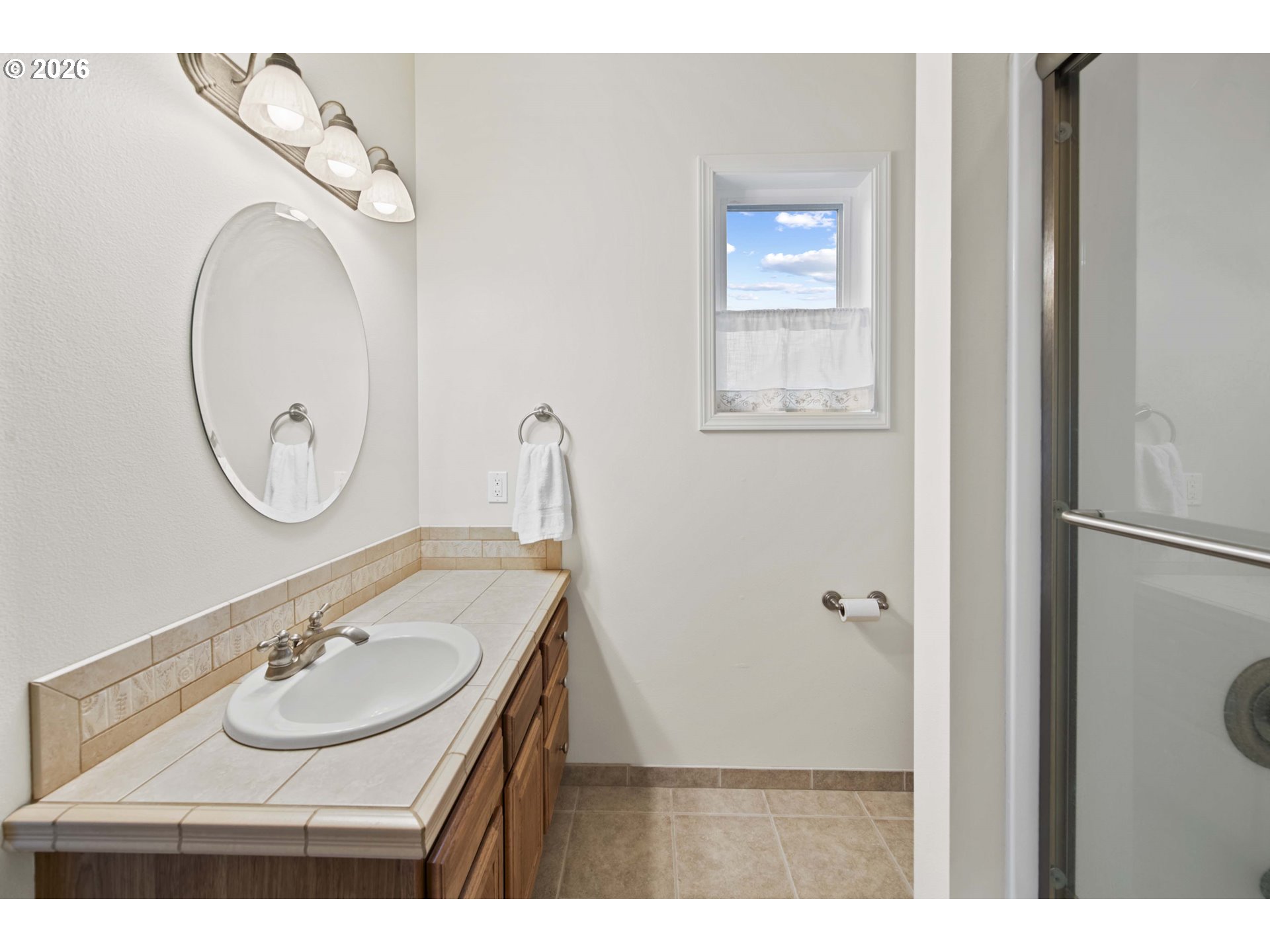 230 Round House Road Astoria, OR 97103 - Photo 34 of 43 a bathroom with a sink and a mirror