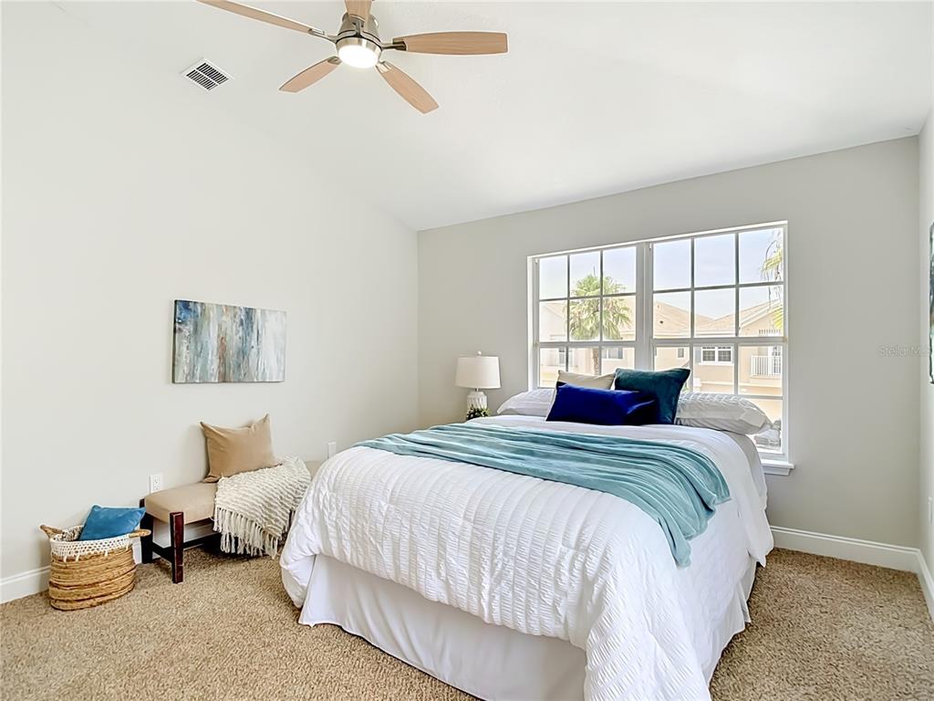5310 Anhinga Trail New Port Richey, FL 34653 - Photo 19 of 27 a bedroom with a bed and window
