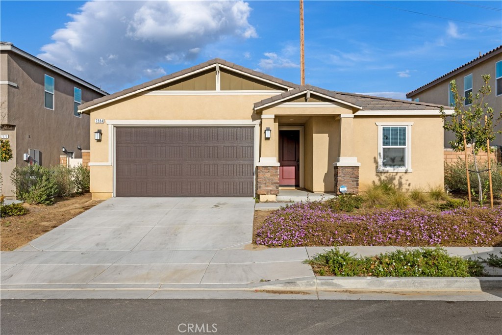 7584 Citrusmoon Court Riverside, CA 92507 - Photo 1 of 1 a front view of a house with garden