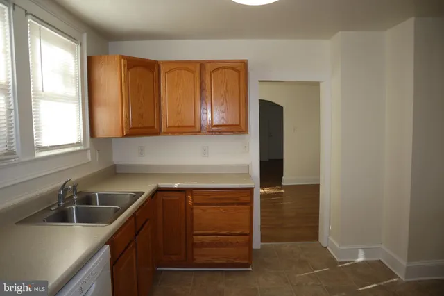 a kitchen with a sink and a window