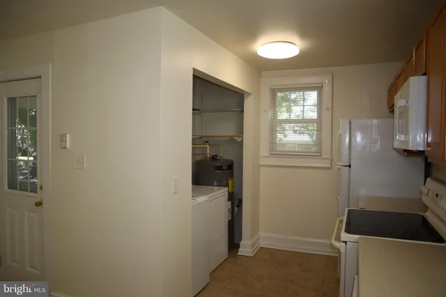 a room with cabinets and a window
