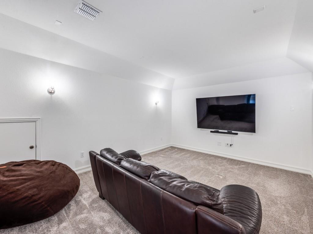 4408 Minnow Cove Oak Point, TX 75068 - Photo 13 of 31 a living room with furniture and a flat screen tv