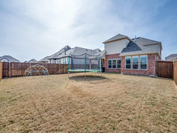 a view of a house with a yard and balcony
