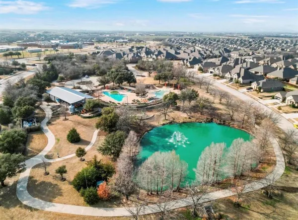 an aerial view of a residential houses with outdoor space