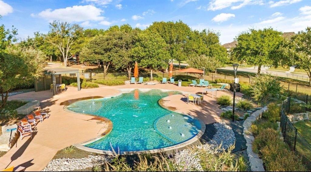 4408 Minnow Cove Oak Point, TX 75068 - Photo 27 of 31 a view of a swimming pool with a patio