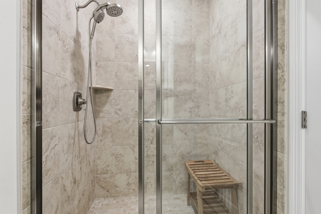 401 Emery Lane, Unit 304 Sudbury, MA 01776 - Photo 13 of 25 a bathroom with a shower