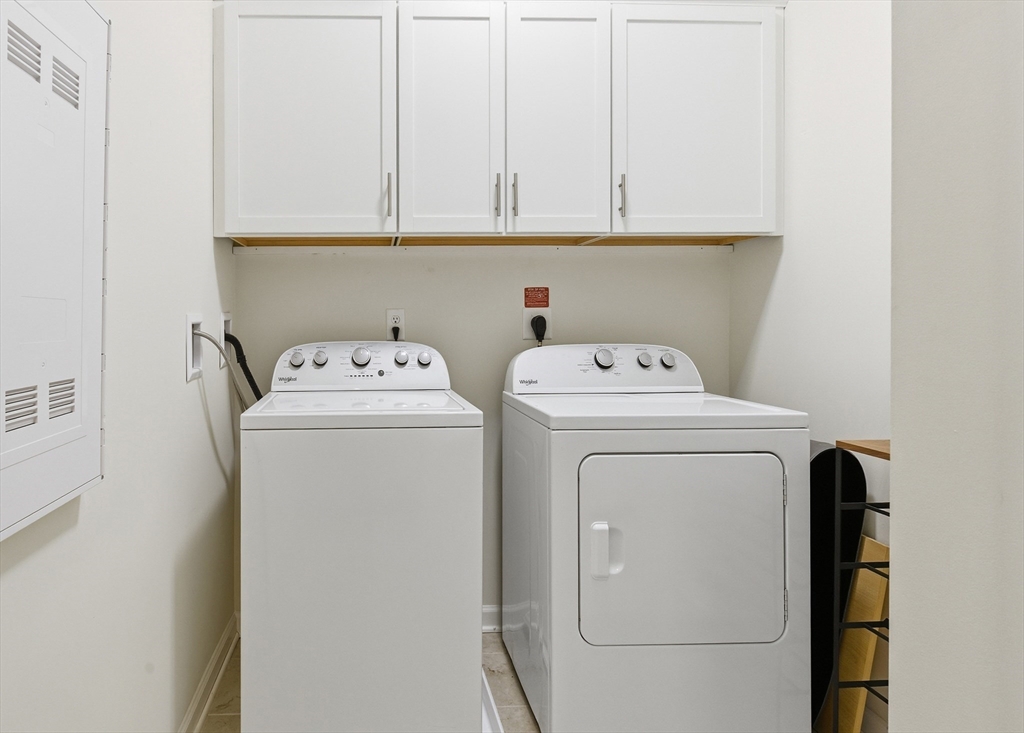 401 Emery Lane, Unit 304 Sudbury, MA 01776 - Photo 18 of 25 a utility room with dryer and washer