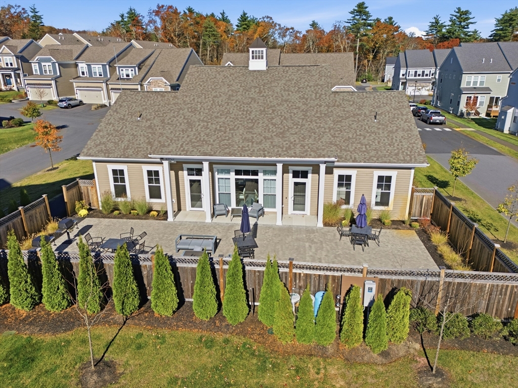 401 Emery Lane, Unit 304 Sudbury, MA 01776 - Photo 20 of 25 a view of a house with pool and chairs