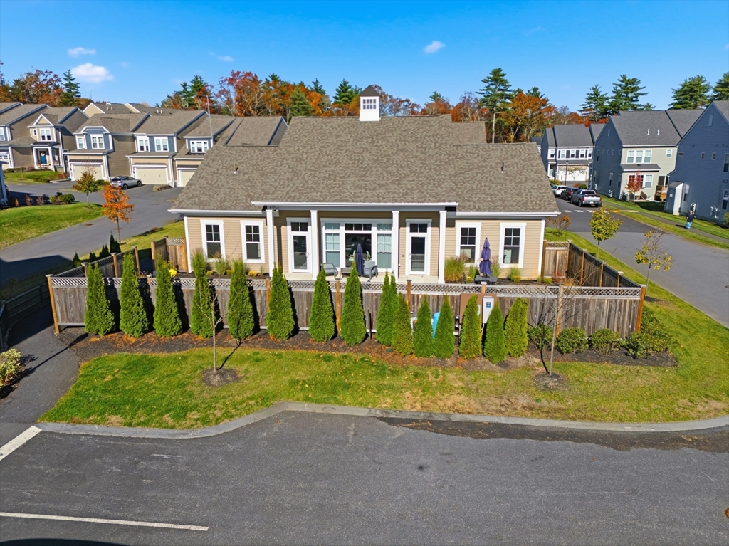 401 Emery Lane, Unit 304 Sudbury, MA 01776 - Photo 21 of 25 front view of a house with a big yard