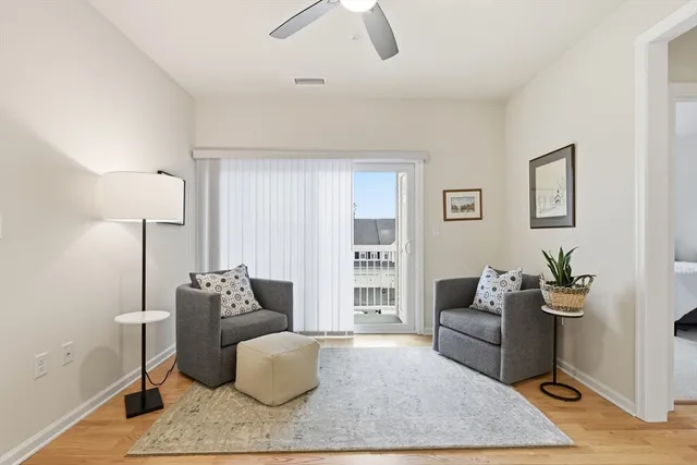 a living room with furniture and a rug