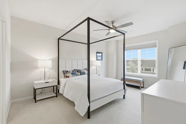 a bedroom with a bed and a table