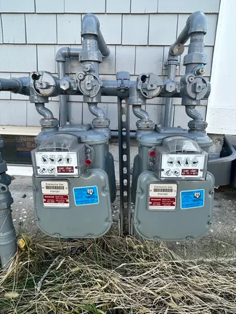 a room with stainless steel appliances granite countertop a sink and a stove