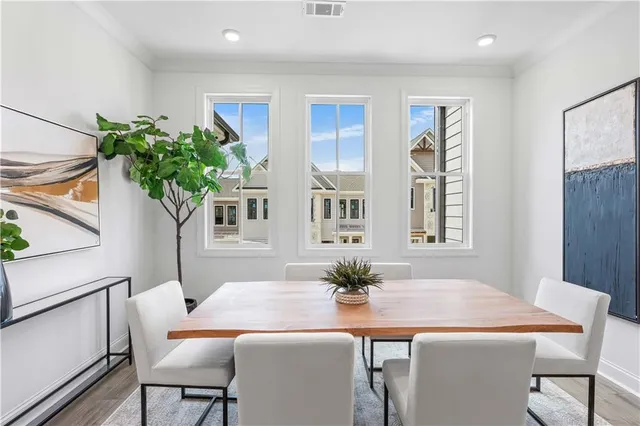 a dining room with furniture and window