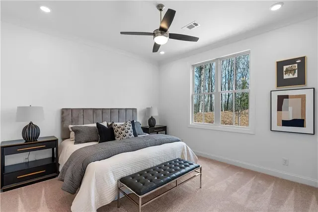 a bedroom with bed and window