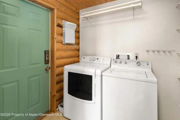 a utility room with dryer and washer
