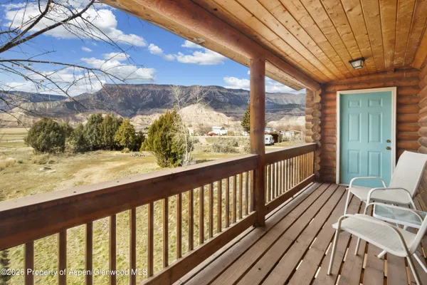 a view of balcony with wooden floor