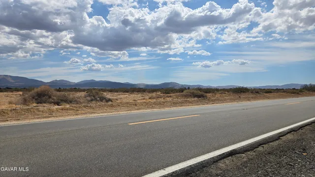 a view of an ocean and a mountain
