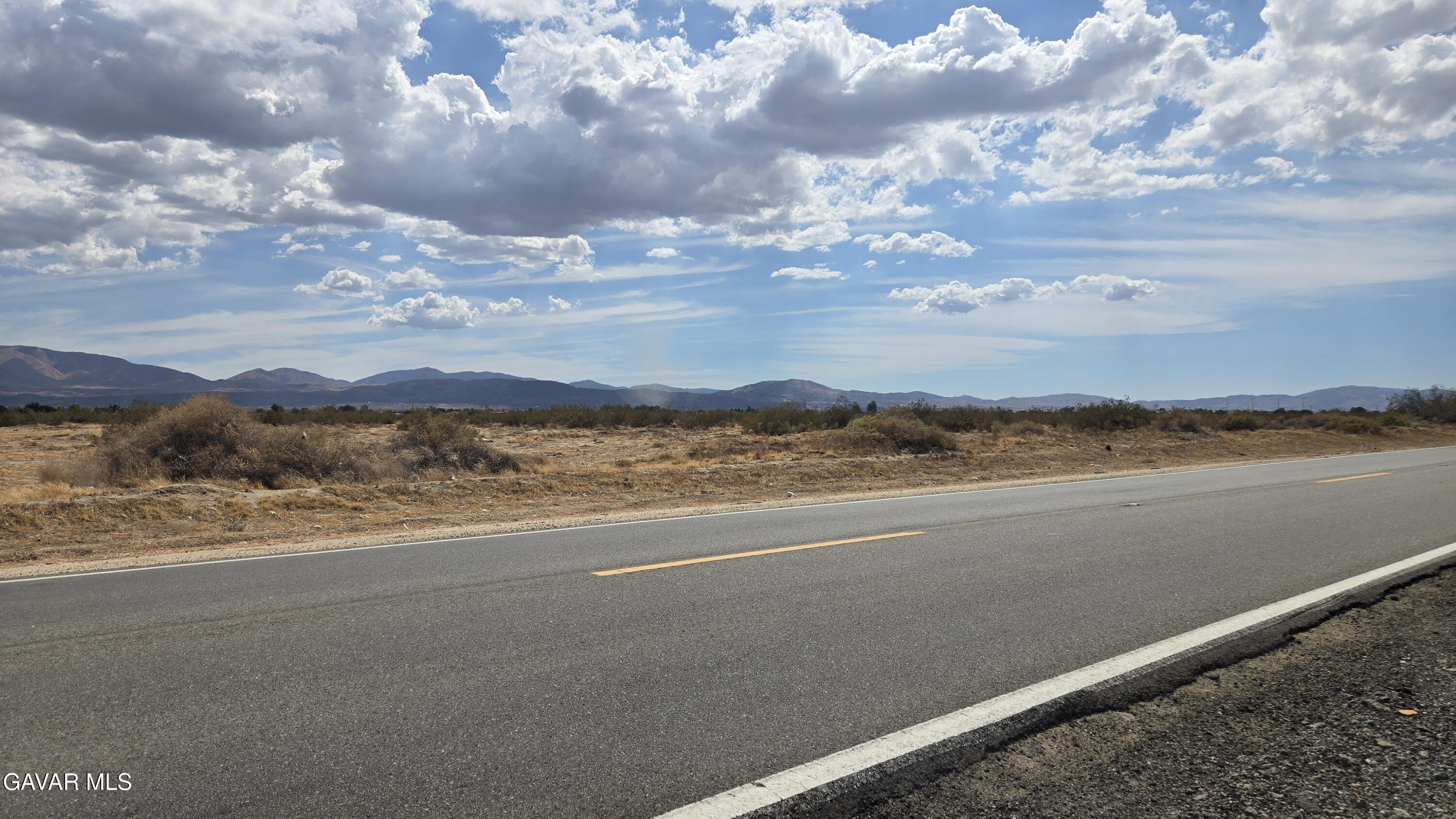a view of an ocean and a mountain