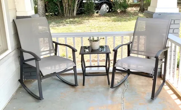 a view of a livingroom with furniture and a window