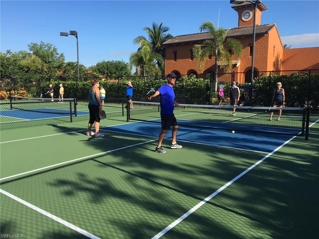 9076 Rialto Street, Unit 6204 Naples, FL 34113 - Photo 48 of 50 Multiple pickleball courts featuring lighting fixtures.