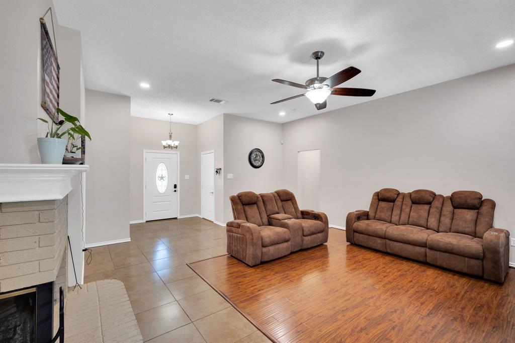 1001 Short Line Boulevard Midlothian, TX 76065 - Photo 21 of 26 Spacious living area featuring wood-finish flooring and tile flooring, a ceiling fan with integrated lighting, and recessed lighting