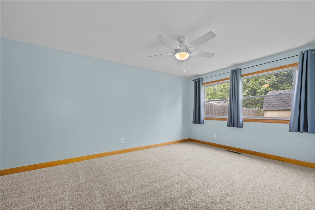 124 Heathgate Road Montgomery, IL 60538 - Photo 16 of 28 a view of an empty room with a window