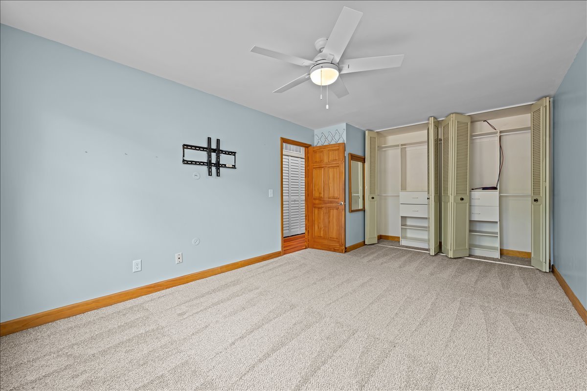 124 Heathgate Road Montgomery, IL 60538 - Photo 17 of 28 an empty room with a window and a ceiling fan