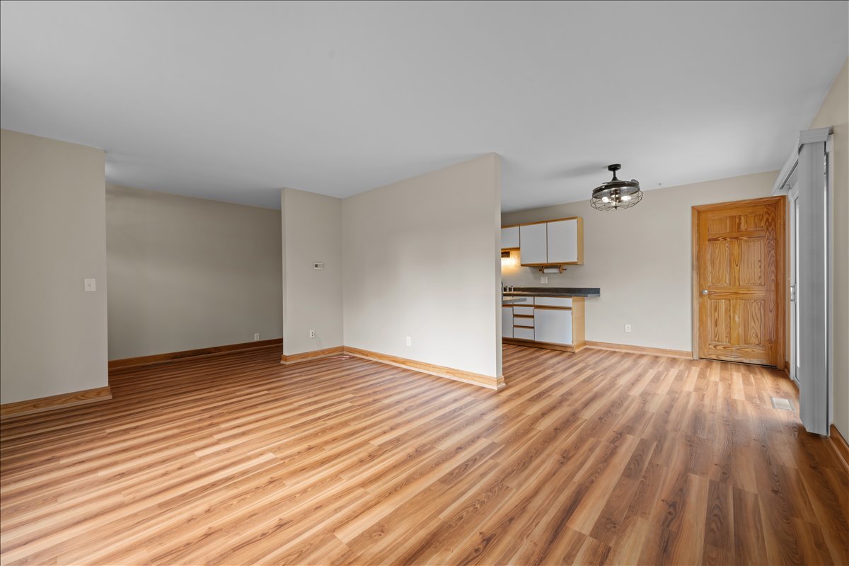 124 Heathgate Road Montgomery, IL 60538 - Photo 9 of 28 a view of empty room with wooden floor