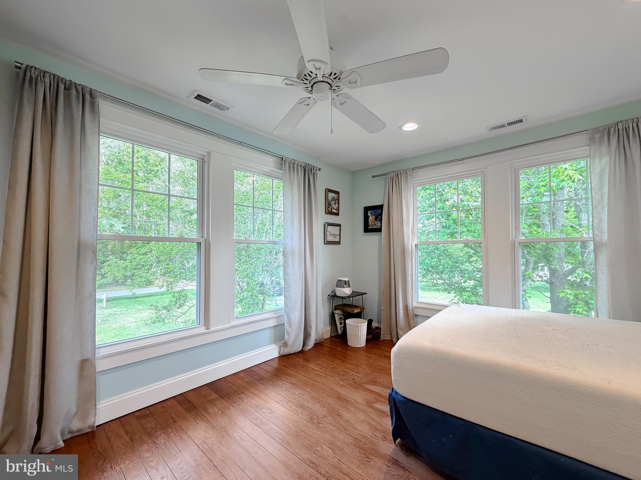 16146 Thomas Road Piney Point, MD 20674 - Photo 24 of 57 a bedroom with a large bed and a large window
