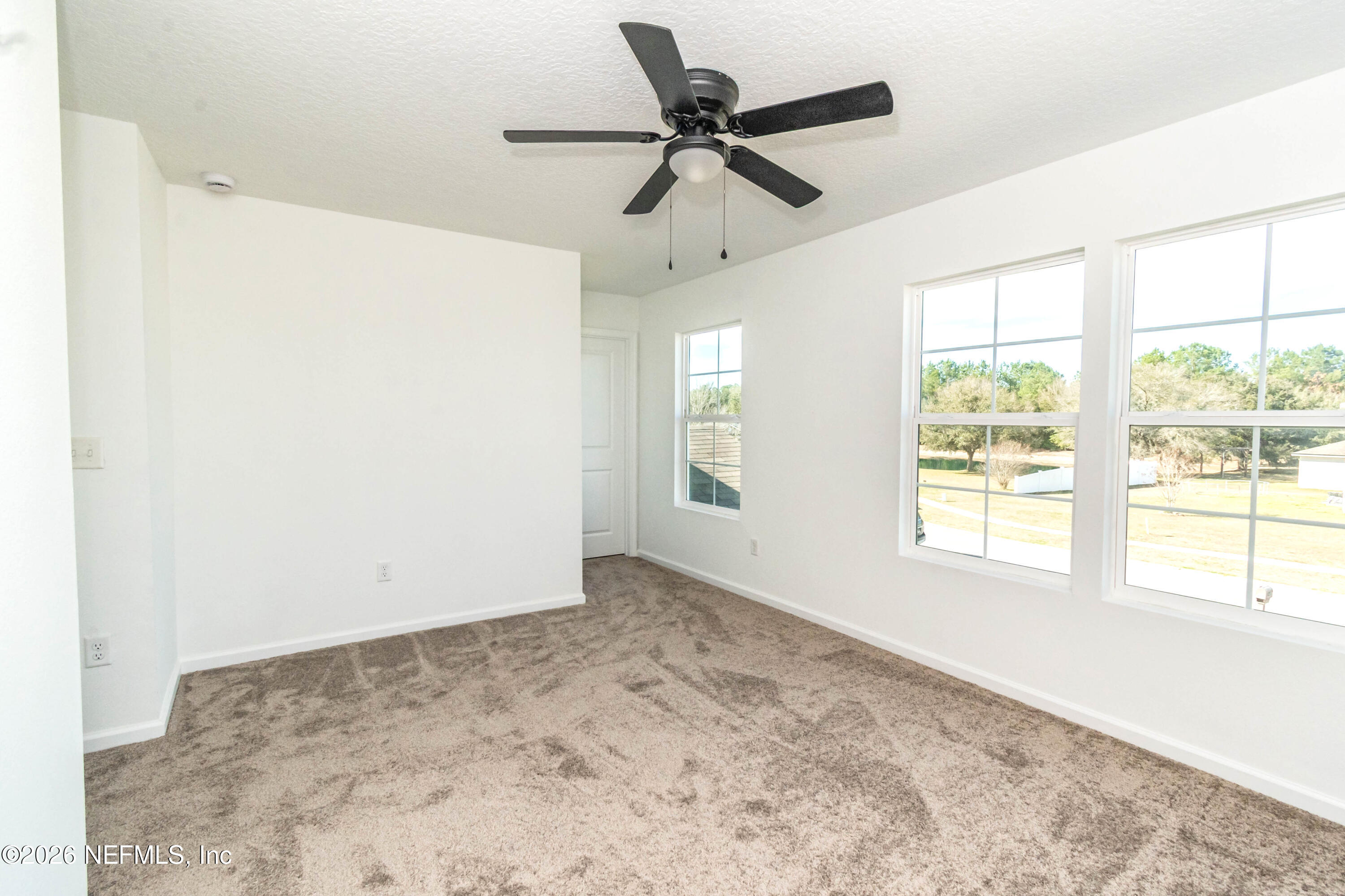 768 Constitution Place Macclenny, FL 32063 - Photo 25 of 41 a view of an empty room with a window