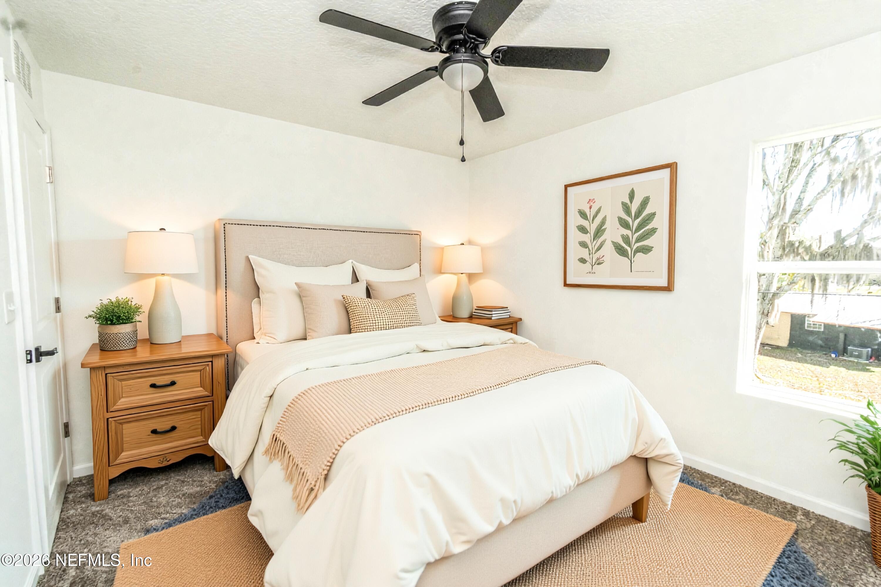 768 Constitution Place Macclenny, FL 32063 - Photo 30 of 41 a bedroom with a bed and a window