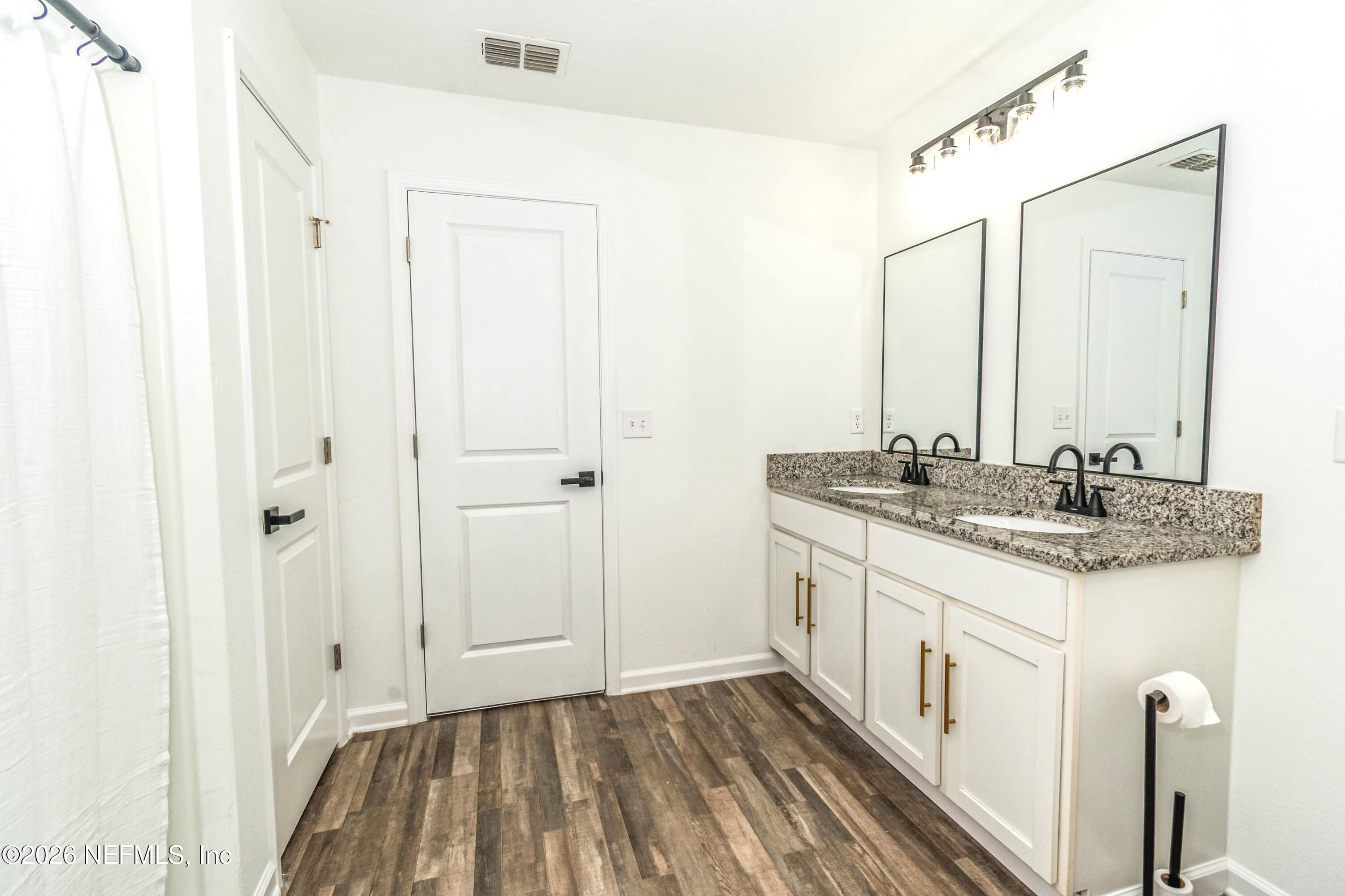 768 Constitution Place Macclenny, FL 32063 - Photo 35 of 41 a bathroom with a granite countertop sink and a mirror