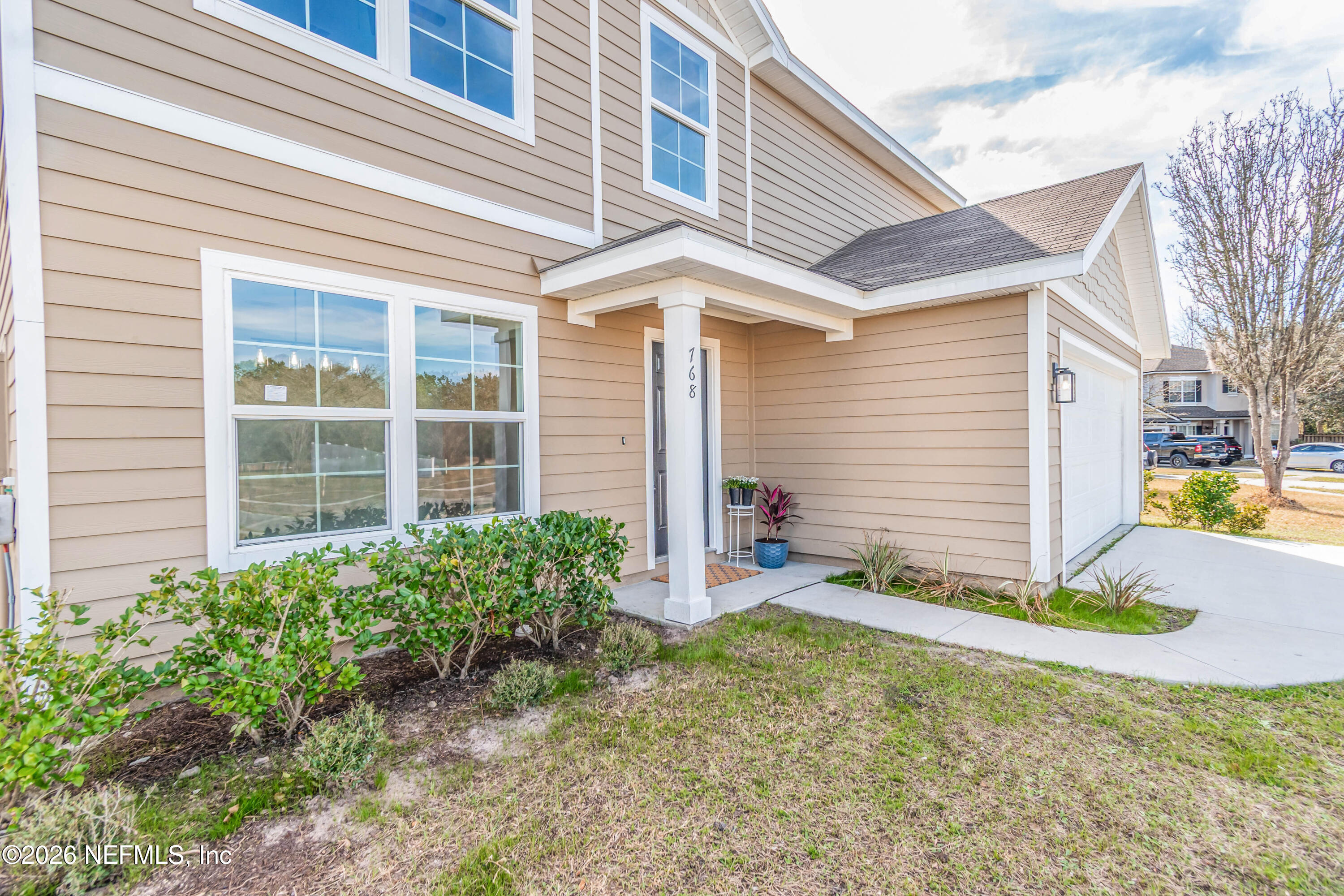 768 Constitution Place Macclenny, FL 32063 - Photo 5 of 41 a view of a backyard with plants