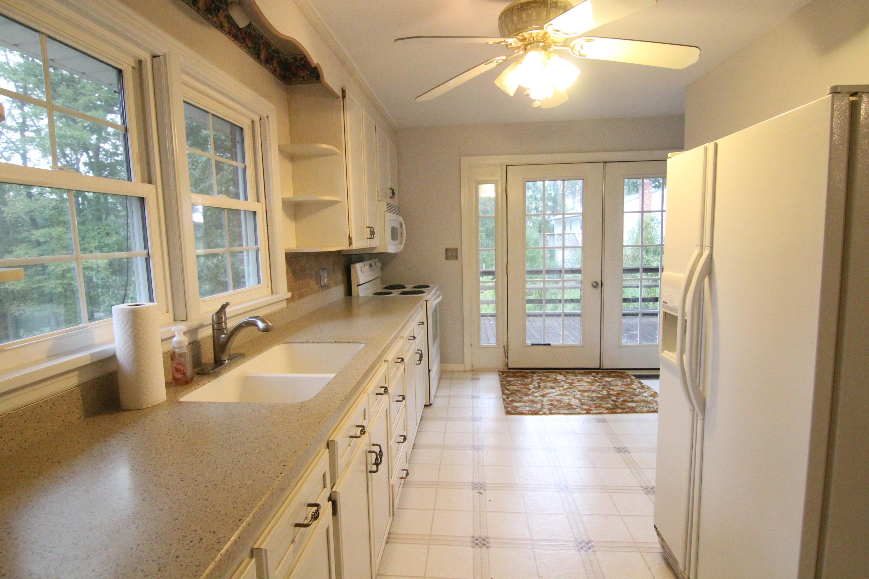1100 Bandy Mill Road Hardy, VA 24101 - Photo 12 of 31 a large white kitchen with a large window