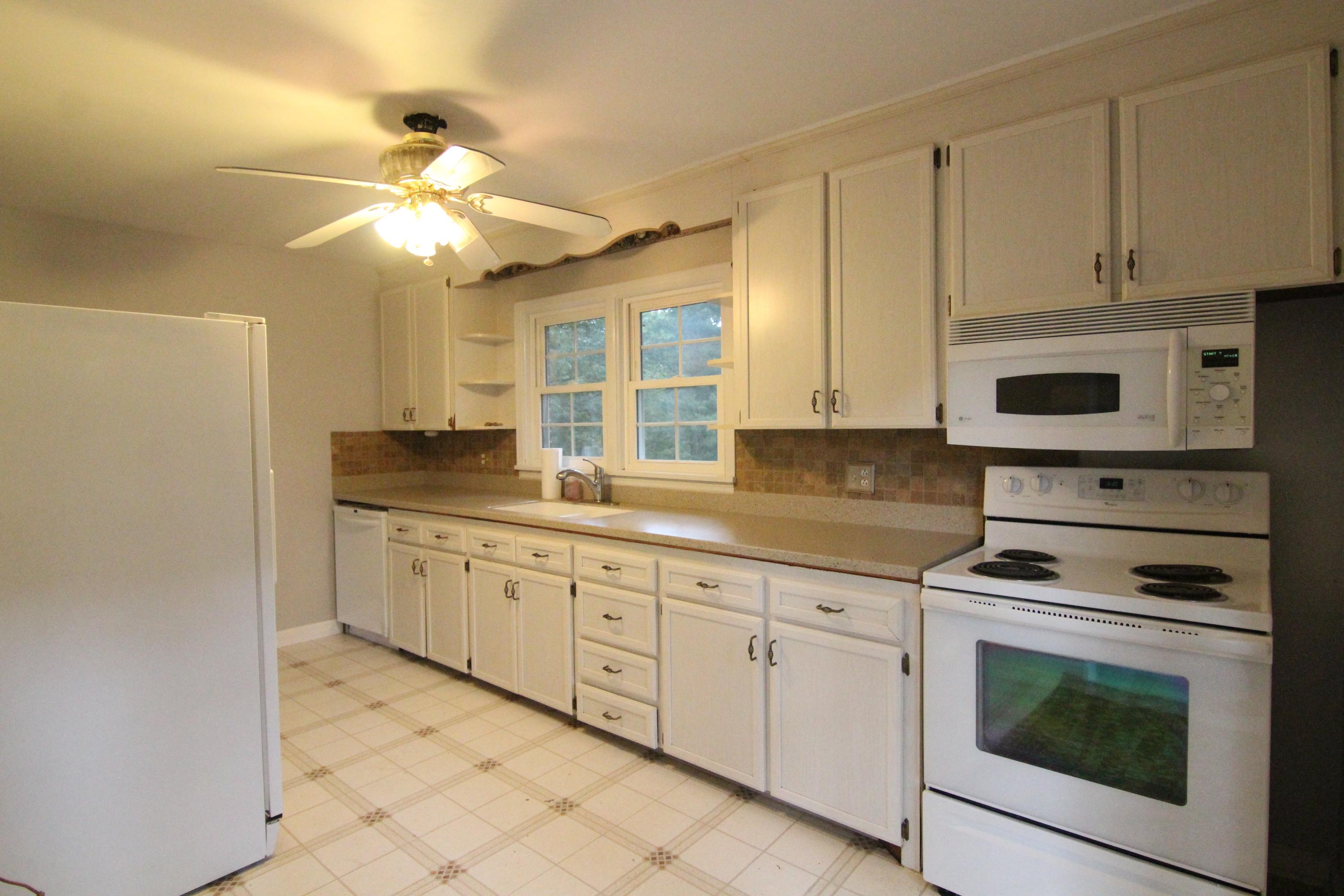 1100 Bandy Mill Road Hardy, VA 24101 - Photo 13 of 31 a kitchen with granite countertop white cabinets white stainless steel appliances with a sink and dishwasher