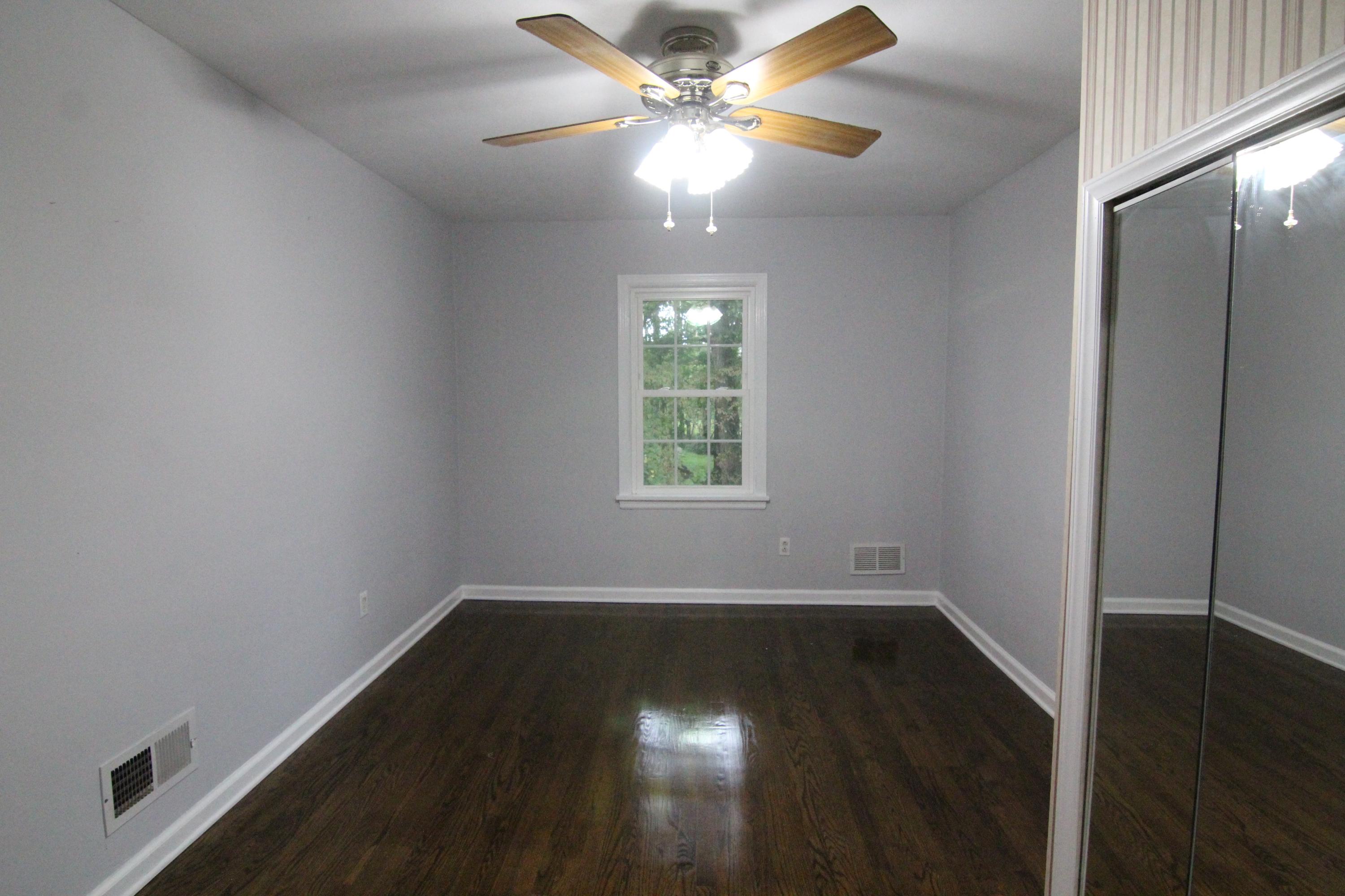 1100 Bandy Mill Road Hardy, VA 24101 - Photo 21 of 31 an empty room with wooden floor fan and windows