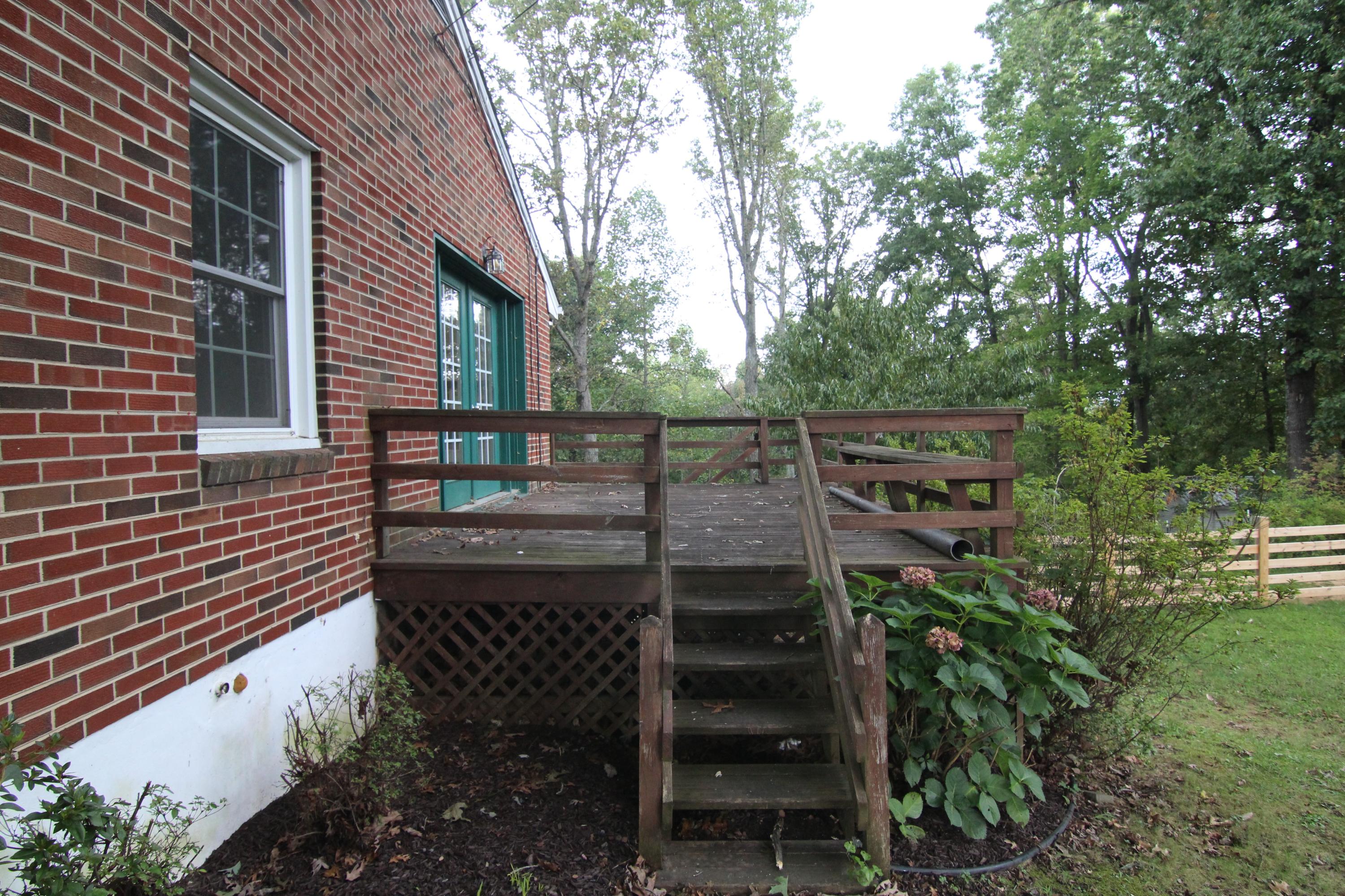 1100 Bandy Mill Road Hardy, VA 24101 - Photo 4 of 31 a view of a patio with table and chairs and wooden fence