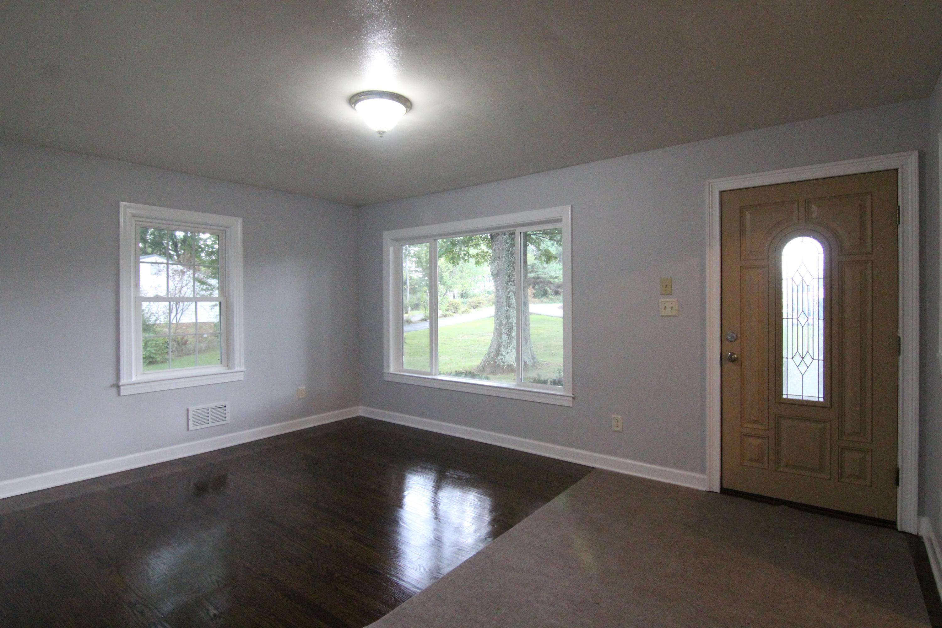 1100 Bandy Mill Road Hardy, VA 24101 - Photo 6 of 31 an empty room with wooden floor and windows
