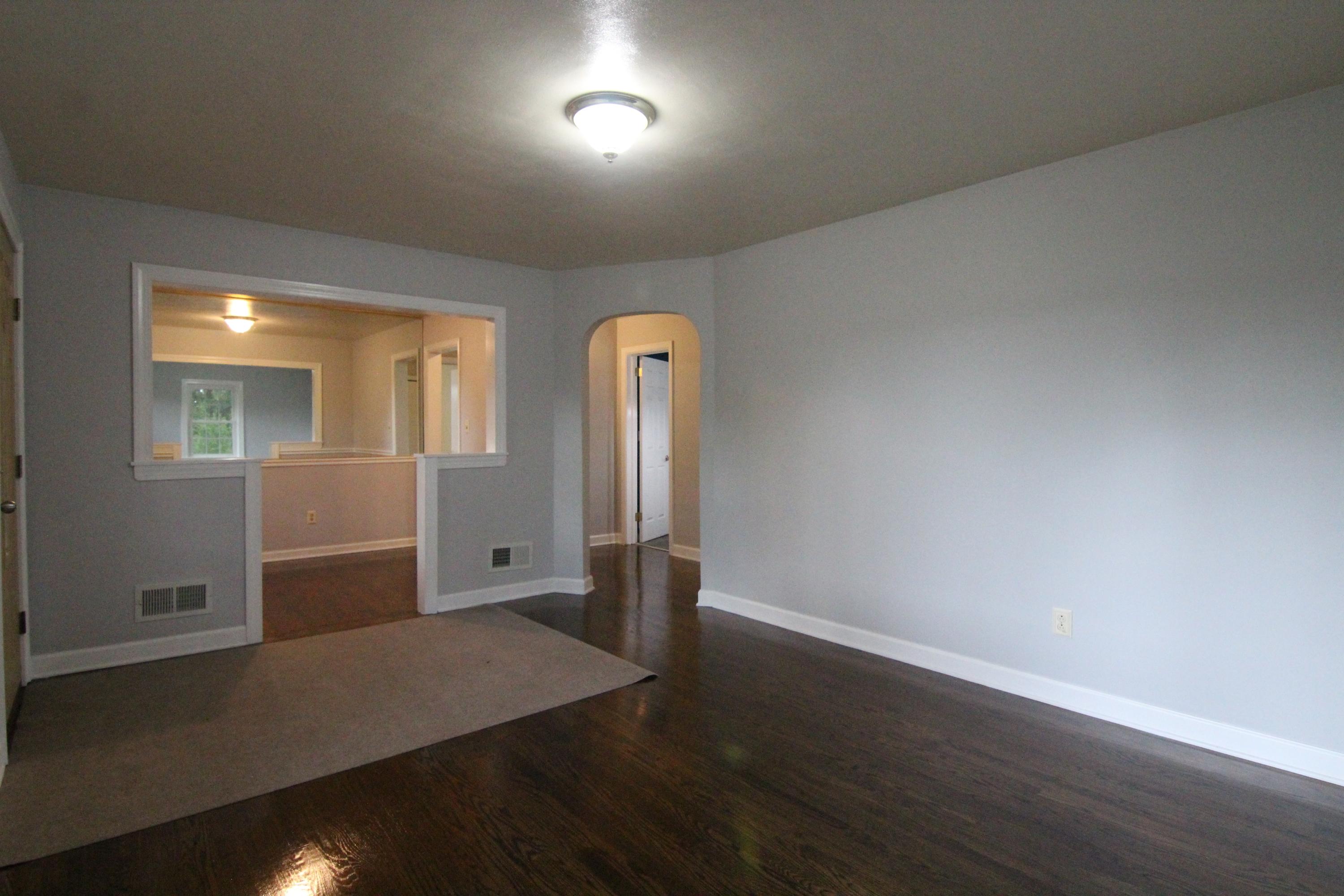 1100 Bandy Mill Road Hardy, VA 24101 - Photo 8 of 31 an empty room with wooden floor and mirror