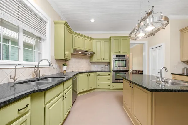 a bathroom with a double vanity sink and mirror