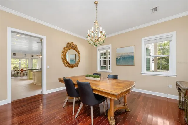 a view of a room with wooden floor and chair