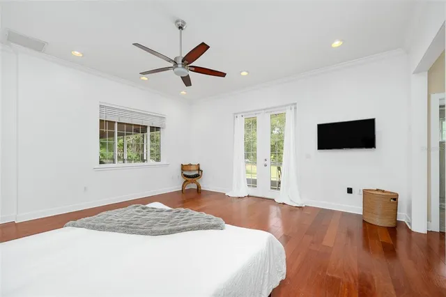 a view of a bathroom with a tub shower and hardwood floor