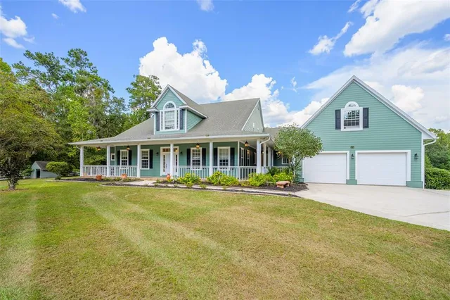 a view of a porch with wooden floor and fence