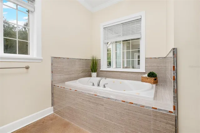 a bathroom with a bathtub and a shower