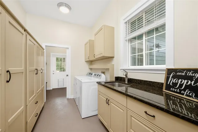 a living room with furniture fireplace and wooden floor